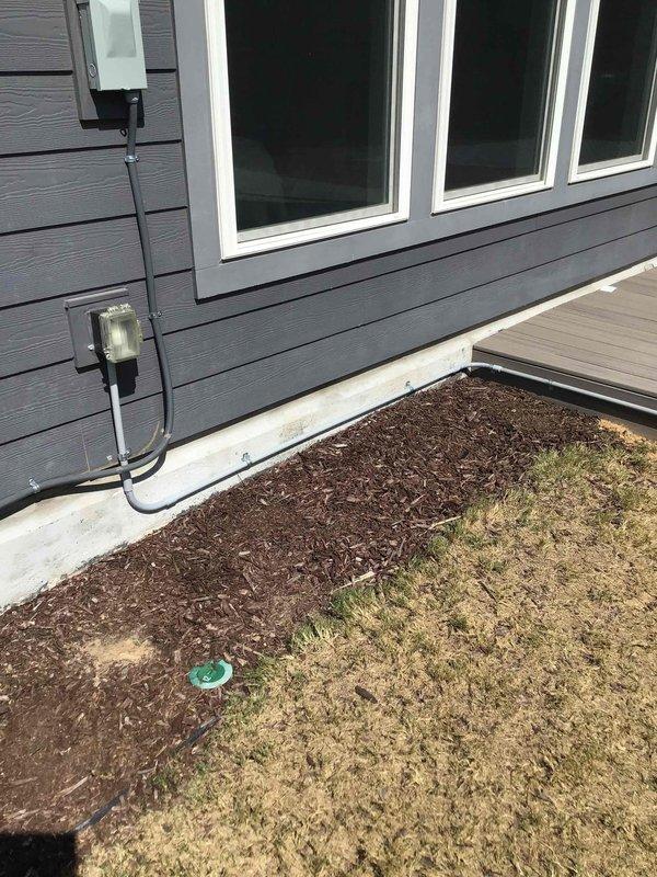 Installed new weatherproof GFCI outlet near deck area with gray conduit run along exterior siding, properly mounted and secured to building exterior. Inspected existing outdoor outlet that was experiencing frequent tripping issues; tested GFCI functionality and determined proper operation. All exterior electrical installations completed per code requirements with appropriate weatherproof enclosures and protection.