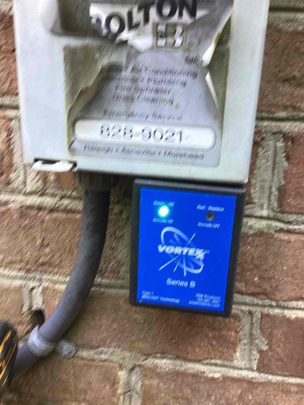 Responded to customer request for quote on additional surge protection for multiple HVAC systems. Inspected existing whole home surge protector previously installed and evaluated current electrical configuration with multiple HVAC units visible on exterior brick wall. Documented installation locations and existing surge protection equipment to provide accurate quote for three individual HVAC surge protectors as recommended by customer's HVAC contractor.