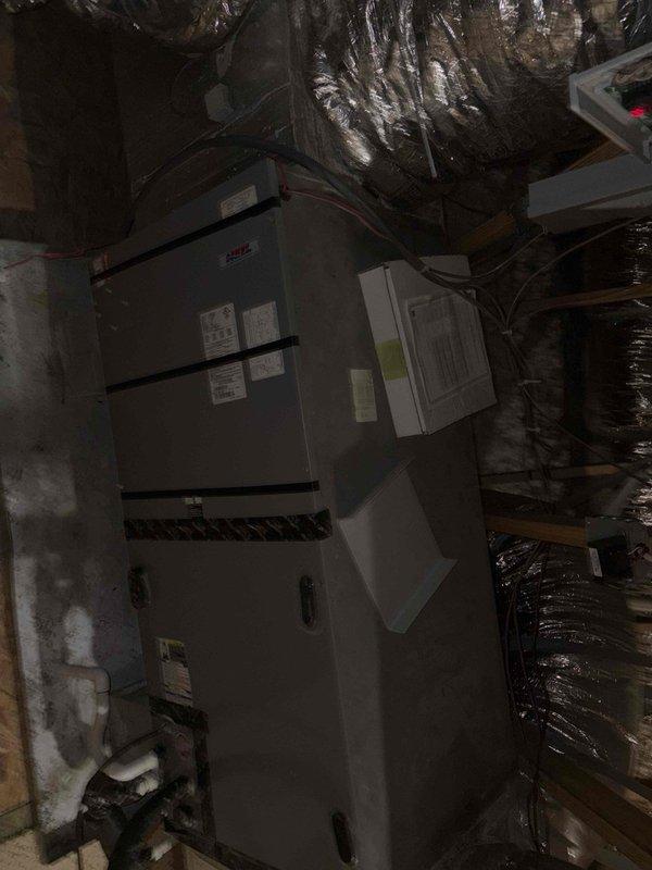 Responded to no cooling complaint at rental property with single HVAC system dating to 2012. Accessed air handler unit in attic space and performed diagnostic evaluation of system components, ductwork, and electrical connections. Inspected condensate drain pan, verified proper installation of flexible ductwork and insulation, and assessed overall system operation to identify cause of cooling failure.