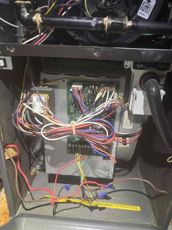 Responded to no cooling complaint with warm air from vents on a 5-year-old single system. Upon inspection, found severely corroded condenser fan motor with extensive rust and oxidation affecting operation, along with control board wiring requiring assessment. Diagnosed failed outdoor fan motor as primary cause of inadequate cooling performance.