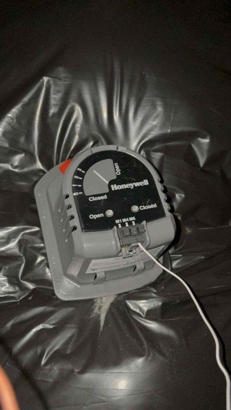 Responded to no cooling complaint on third floor system. Upon arrival, performed diagnostic testing of the HVAC equipment. Used digital multimeter to verify voltage readings at the unit, which measured 383.0 volts, indicating potential electrical supply issues. Inspected the Honeywell motorized zone damper control serving the third floor zone. Found the damper actuator displaying proper LED indicators for open/closed positions. Tested damper operation and confirmed mechanical function. Evaluated the zoning system's ability to deliver conditioned air to the third floor area. Documented equipment conditions with diagnostic readings and visual inspection of damper control mechanism and electrical connections.