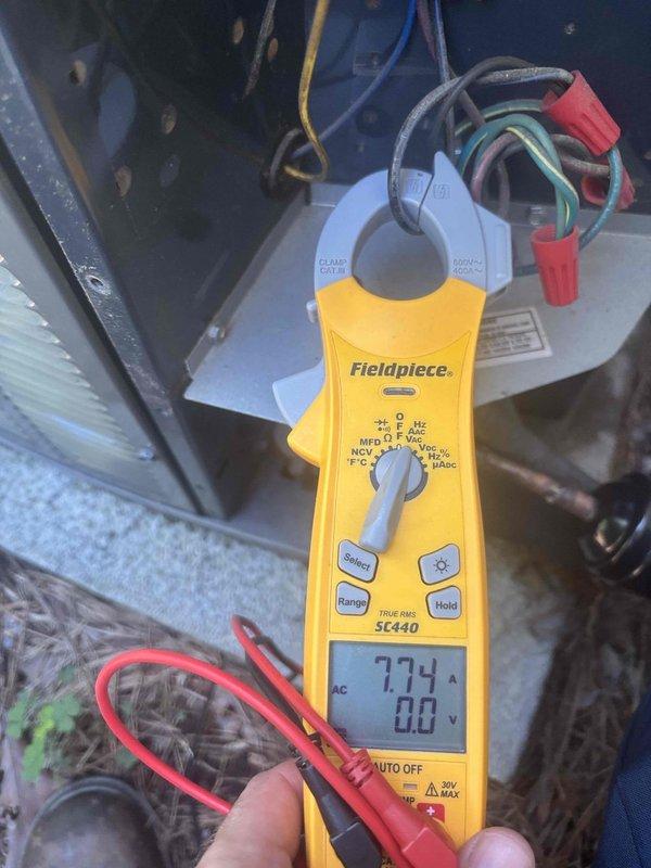 Responded to no cooling complaint on upper level air handler system. Upon arrival, diagnosed intermittent power cycling issue affecting thermostat operation. Performed electrical diagnostics using clamp meter to verify amperage draw and voltage supply at air handler located in attic space. Identified and resolved power supply issue causing unit to cycle on and off unexpectedly. Verified proper system operation with stable amperage readings of 77.4A and confirmed unit maintaining consistent power to thermostat. System restored to normal cooling operation with no further cycling issues observed.