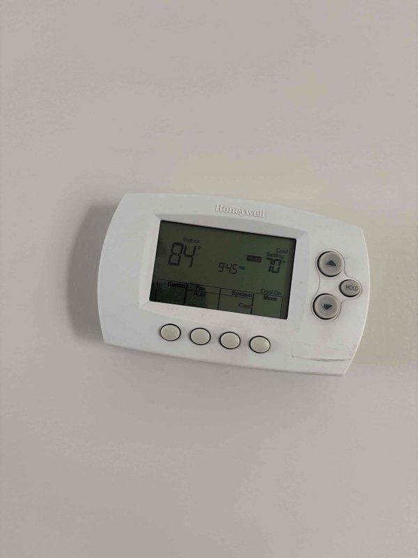 Responded to no cooling call on 8-9 year old gas pack system with dual thermostats displaying "no signal" error. Upon arrival, found thermostats reading 84°F actual temperature with 70°F setpoint but unable to communicate with equipment. Accessed crawlspace and inspected gas pack unit where evidence suggested recent disturbance to low voltage wiring or control transformer connections, likely from recent home inspection activity. Reconnected loose low voltage wiring at equipment terminal block, restored power to communication circuit, and verified proper signal transmission between thermostats and gas pack. Tested system operation through full cooling cycle, confirmed both thermostats regained communication and control functionality, and verified unit achieved proper cooling output. System restored to normal operation with all controls responding appropriately.