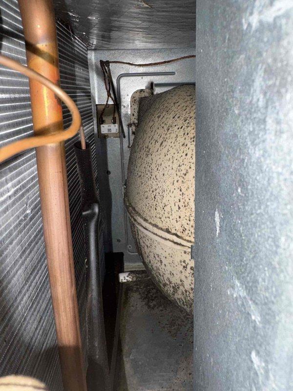 Responded to no cooling call on 8-9 year old gas pack system with dual thermostats displaying "no signal" error. Upon arrival, found thermostats reading 84°F actual temperature with 70°F setpoint but unable to communicate with equipment. Accessed crawlspace and inspected gas pack unit where evidence suggested recent disturbance to low voltage wiring or control transformer connections, likely from recent home inspection activity. Reconnected loose low voltage wiring at equipment terminal block, restored power to communication circuit, and verified proper signal transmission between thermostats and gas pack. Tested system operation through full cooling cycle, confirmed both thermostats regained communication and control functionality, and verified unit achieved proper cooling output. System restored to normal operation with all controls responding appropriately.