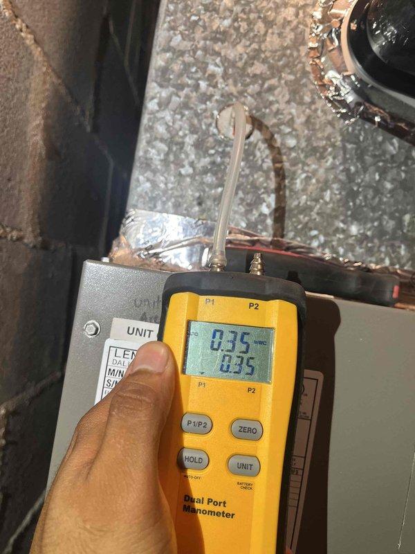Completed comprehensive heating and air maintenance including 80-point inspection on both HVAC units. Performed outdoor coil cleaning, burner cleaning, and verified gas pressures using digital manometer, with readings at 0.35" W.C. confirming proper system operation. Conducted thorough safety inspections on Lennox unit located in attic space over garage, checking all electrical connections, controls, and operational components to ensure safe and efficient system performance.