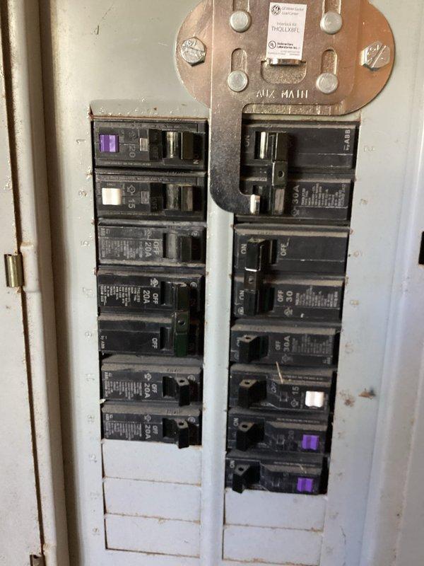 Responded to service call for automatic gate breaker repeatedly tripping at 1985 residence. Inspected main electrical panel and outdoor gate control switch box mounted on fence posts. Diagnosed tripping issue, performed necessary repairs to breaker circuit, and tested system operation to ensure proper function and prevent battery drainage concerns. Additionally corrected misaligned barn light fixture that was previously installed at an improper angle, adjusting mounting to achieve proper straight alignment.