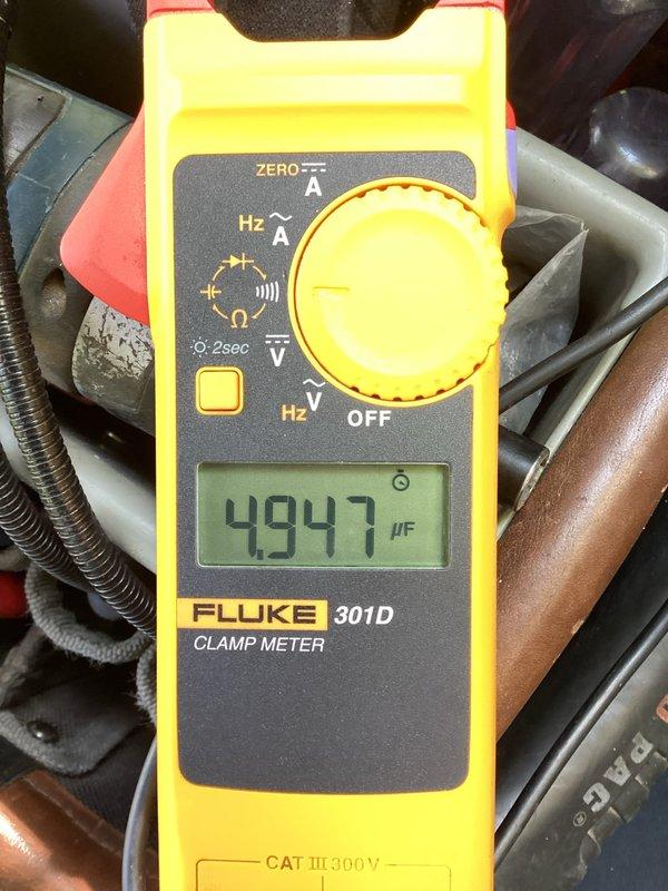 Responded to service call for HVAC system repeatedly tripping the circuit breaker. Upon arrival, performed electrical diagnostics using clamp meter to measure amperage draw and capacitance readings on the air conditioning system. Inspected main electrical panel and identified the dedicated A/C circuit breaker experiencing overcurrent conditions. Measured capacitor reading of 4947 μF, indicating potential component failure causing excessive current draw. Verified the HVAC system was the only equipment affected by the breaker trips, isolating the issue to the air conditioning unit and its associated electrical components.