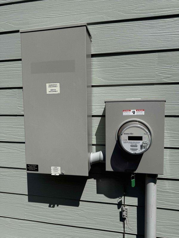 Conducted site assessment for EV charger installation in garage of 2021 home. Evaluated existing electrical service panel and main disconnect located in garage, confirming adequate capacity and proper grounding for Level 2 charging circuit. Documented current electrical infrastructure including service entrance equipment, meter base, and panel configuration to determine optimal installation pathway for customer-provided charging unit.