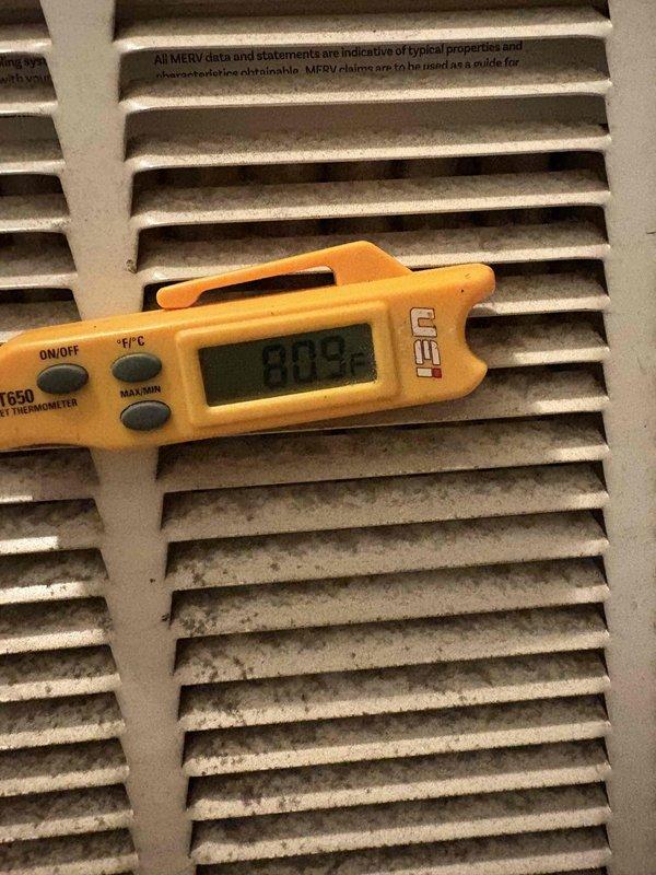 Responded to no cooling complaint on 7-year-old air conditioning system. Upon arrival, measured supply air temperature at 80.9°F at return air grill, confirming inadequate cooling performance. Inspected air distribution system and documented condition of return air grille showing dust accumulation, indicating potential airflow restriction requiring filter maintenance or replacement to restore proper system operation. Responded to no cooling complaint on 7-year-old air conditioning system. Upon arrival, measured supply air temperature at 80.9°F at return air grill, confirming inadequate cooling performance. Inspected air distribution system and documented condition of return air grille showing dust accumulation, indicating potential airflow restriction requiring filter maintenance or replacement to restore proper system operation.