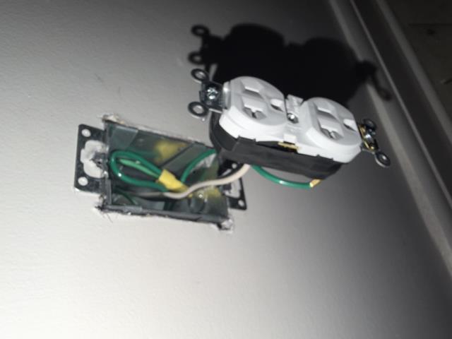 I installed a GFCI outlet near the fan/light outlet. I cut sheetrock and ran M/C cable from switches to receptacles. I ensured safety and compliance with electrical standards.