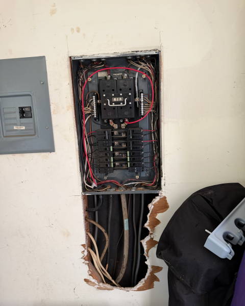 We replaced an old electrical panel with a new 100 AMP main breaker panel, ensuring it meets NEC standards. The old fused ITE panel was removed and the new system was installed.