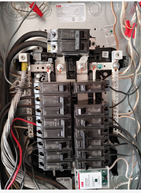 I installed a surge protector on a previously burned and hazardous electrical panel, ensuring safety and preventing potential electrical fires.