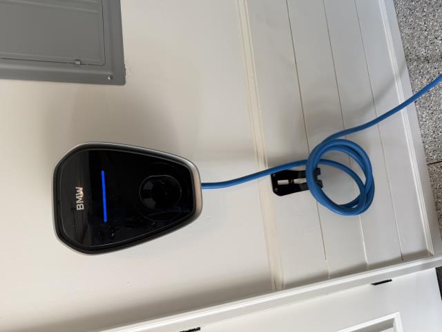 I safely disconnected the BMW EV charging station, transported it to the client's new home, and reinstalled it, ensuring everything functioned perfectly.