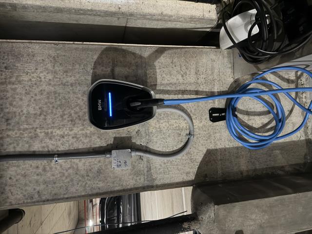 I extended a 40 amp circuit for a BMW EV charging station, ensuring a dedicated bottom entry. I also installed a 4-inch LED wafer light for enhanced visibility.