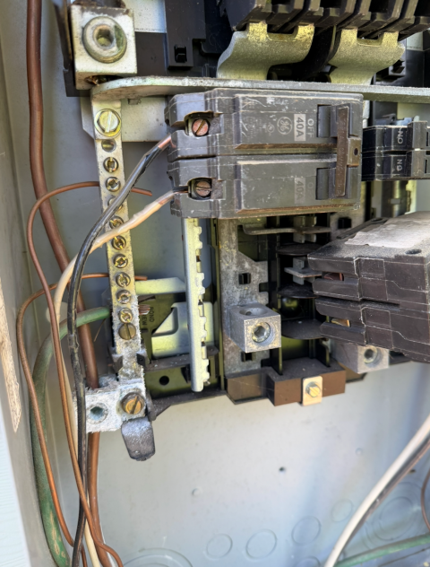 I examined the electrical panel, buss bars, and overcurrent protection devices for any faults, signs of burning, arcing, or potential hazards, ensuring everything was safe and functioning properly.