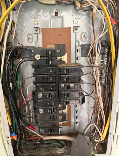 I examined the electrical panel, buss bars, and overcurrent protection devices for any faults, signs of burning, arcing, or potential hazards, ensuring everything was safe and functioning properly.