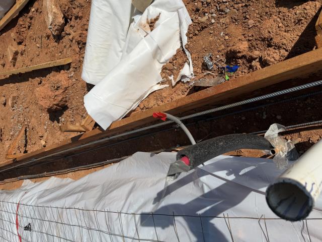 I installed inslab conduits to prepare for future kitchen island cabinets. This involved precise measurements, cutting, and securing conduits within the slab for smooth wiring later.