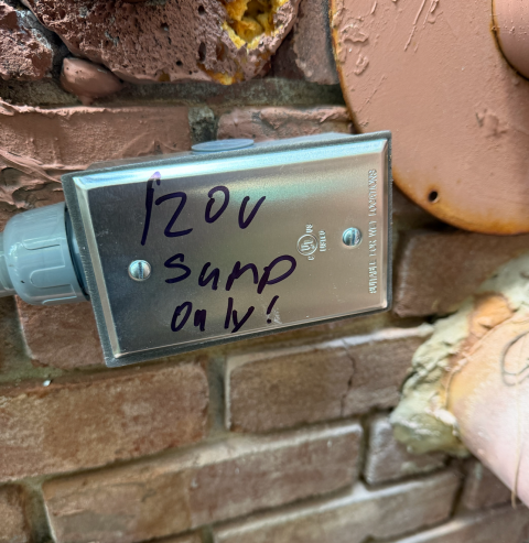 We installed a 110V indoor outlet within 5 feet of the power source, dedicated to a sump pump. This outlet is located below the basement window and is on a 20-amp circuit, ensuring reliable operation.