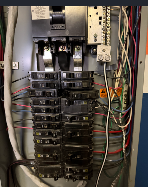I installed a dedicated circuit for a single room. I addressed an electrical panel issue by reseating the breakers and securing them with buss point screw covers.
