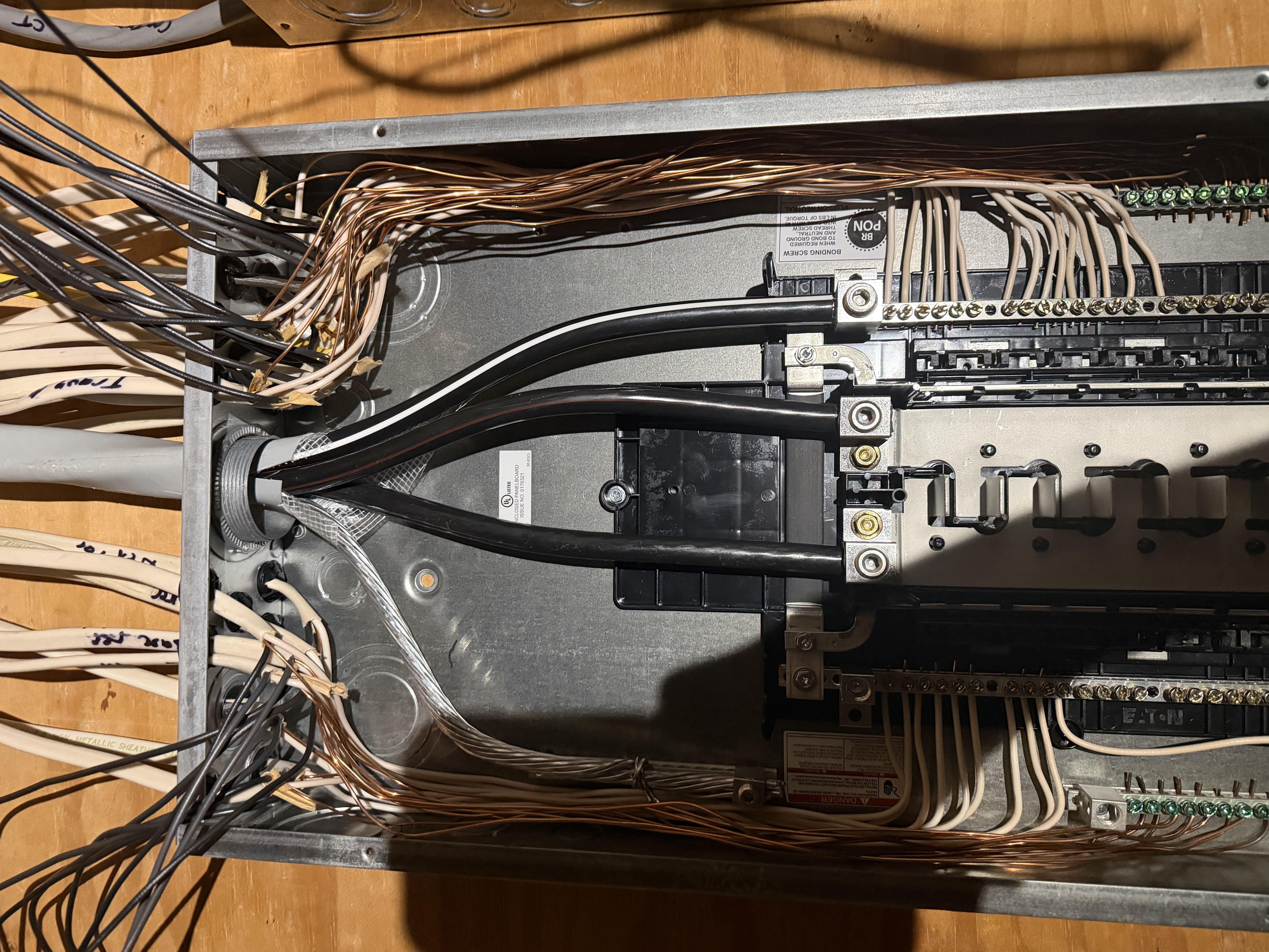 Rough-in electrical panel branch circuits and install recessed can-light wiring in the kitchen as part of the renovation.