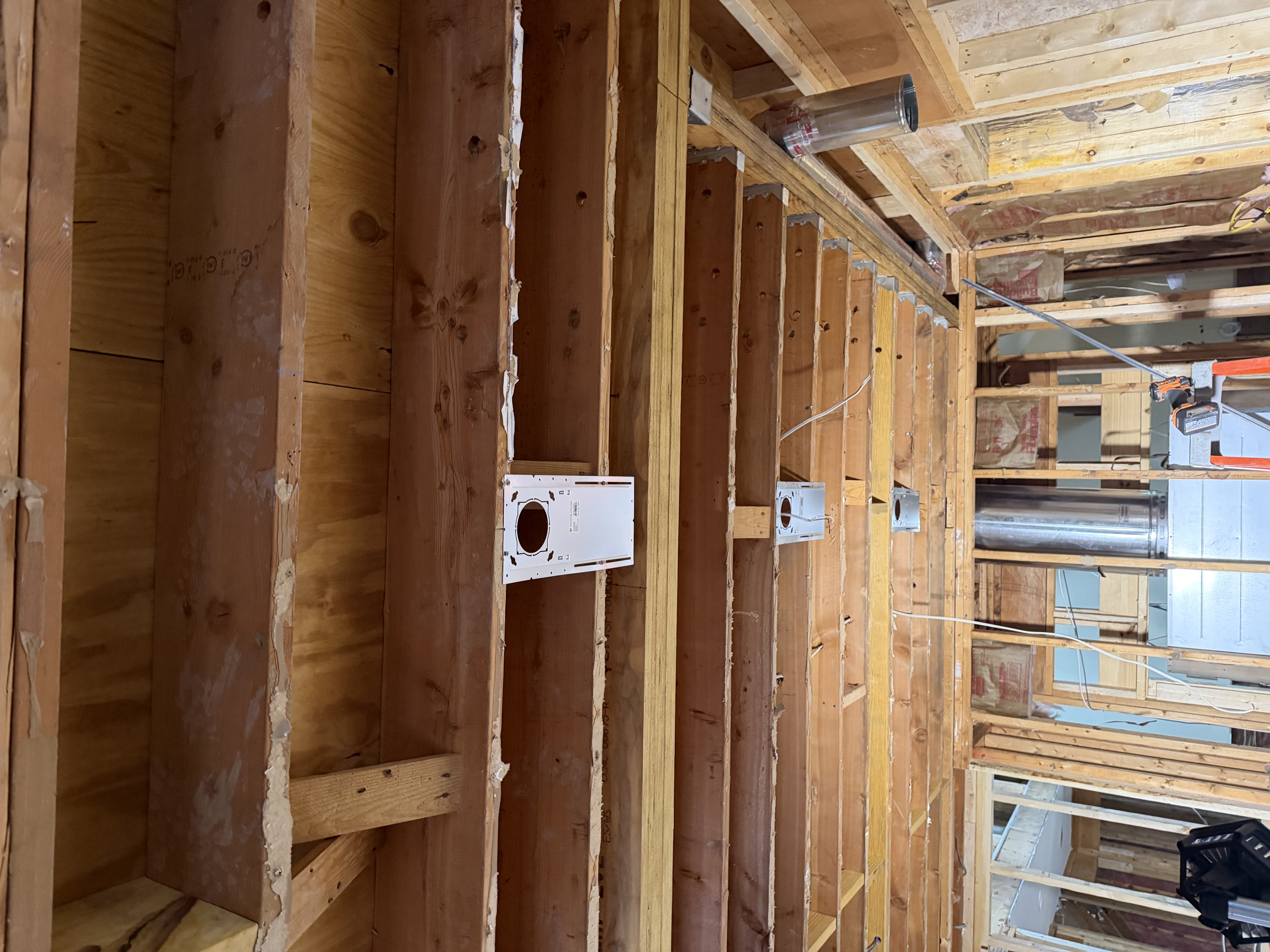 Rough-in electrical panel branch circuits and install recessed can-light wiring in the kitchen as part of the renovation.