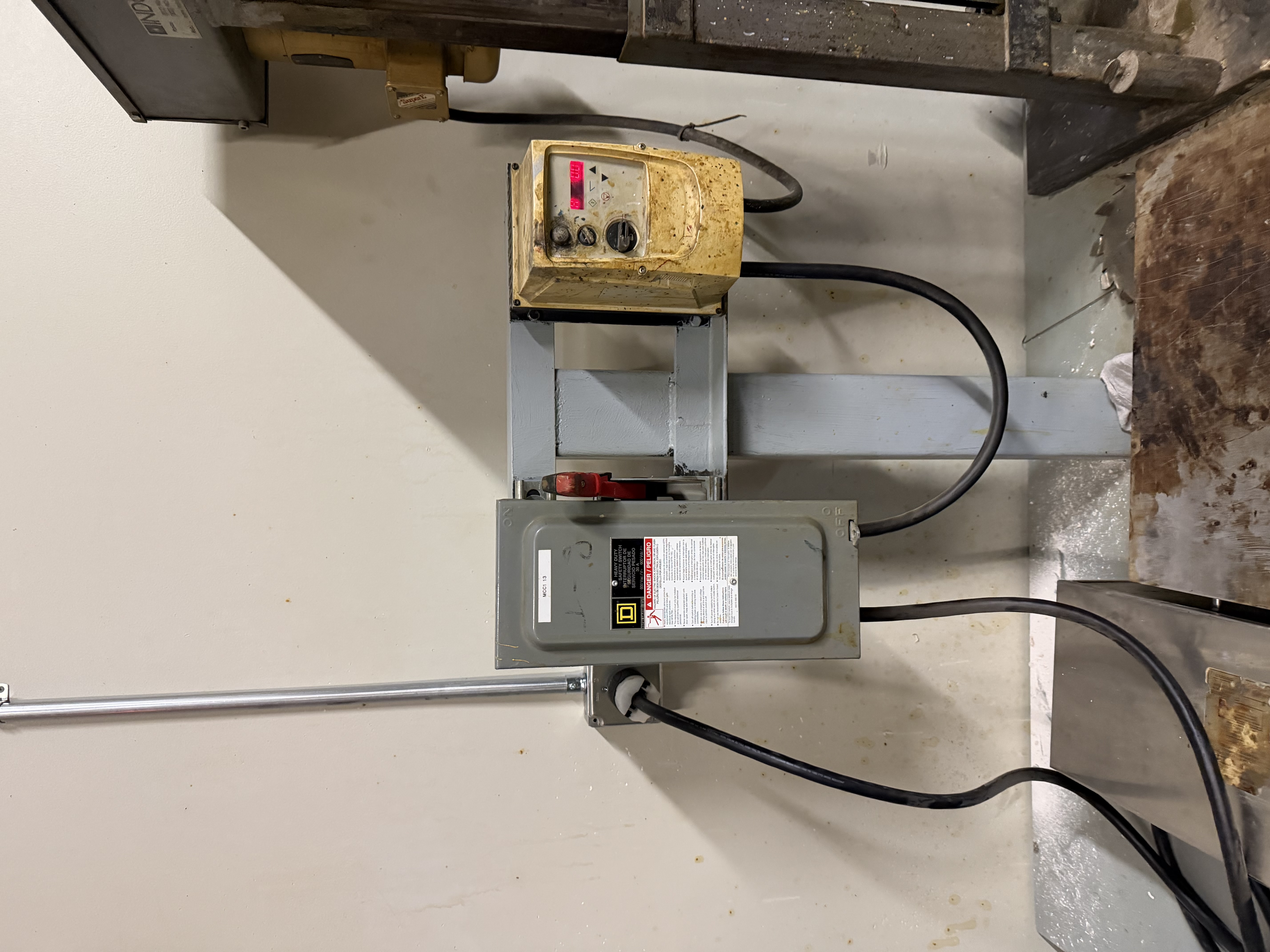 I extended the 480v circuit, installed EMT conduit, mounted a disconnect, and added wiring for the hot plate. The work was precise and adhered to safety standards.