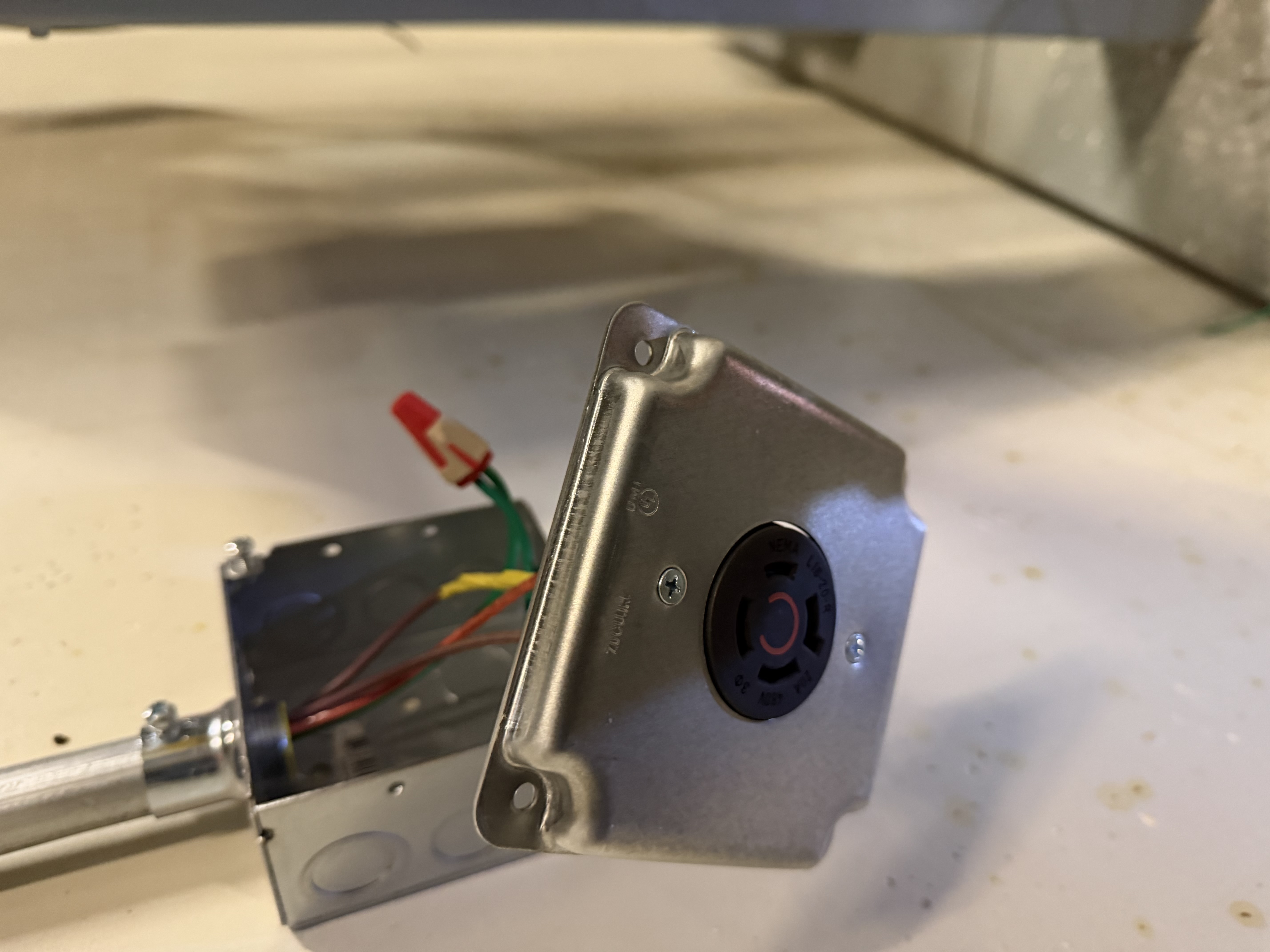 I extended the 480v circuit, installed EMT conduit, mounted a disconnect, and added wiring for the hot plate. The work was precise and adhered to safety standards.