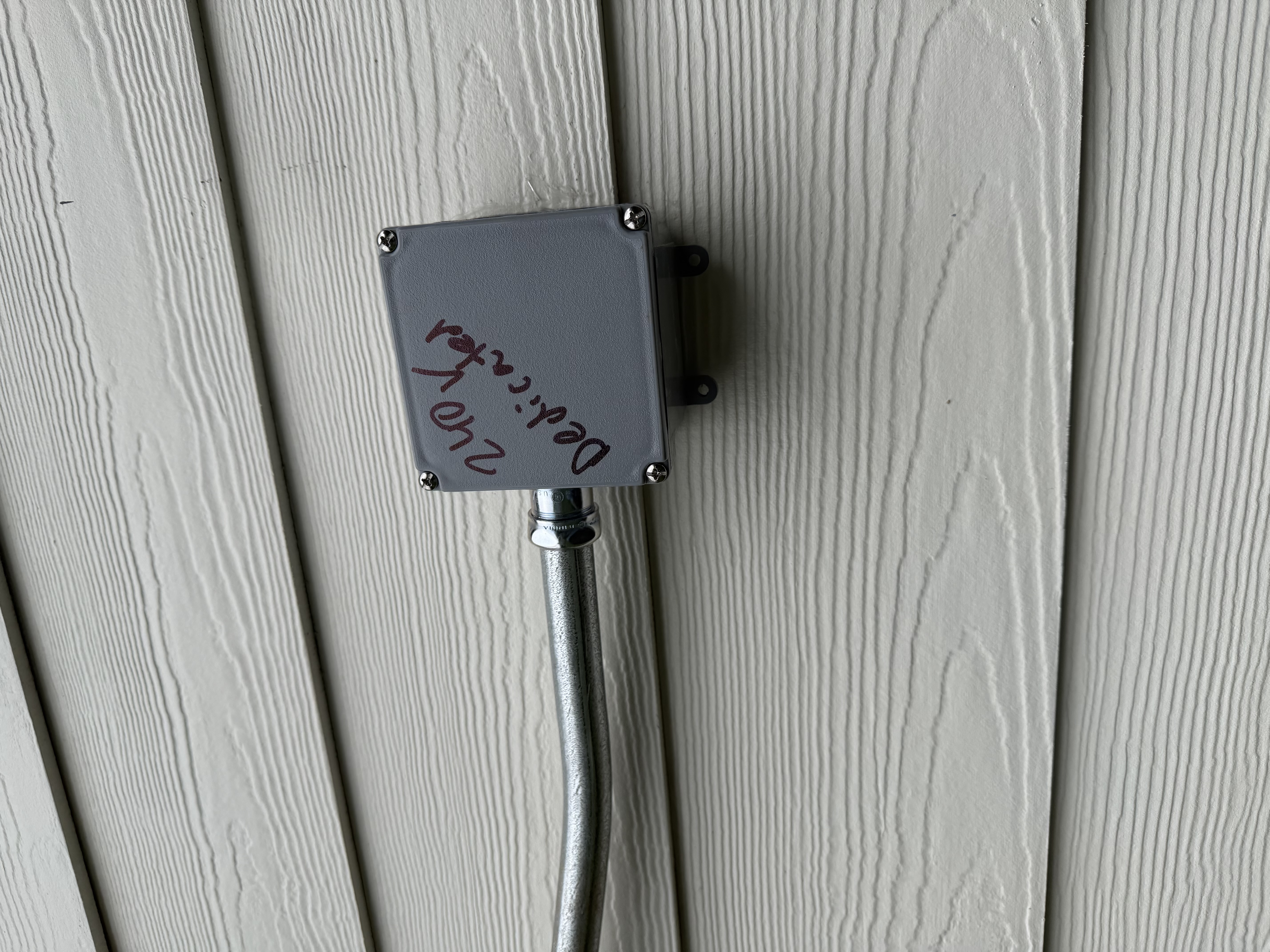 Installed a 30 amp, 120/240V circuit, ran conduit from the existing GE panel, and repaired an outdoor floodlight. Fixed code issues by installing a junction box.