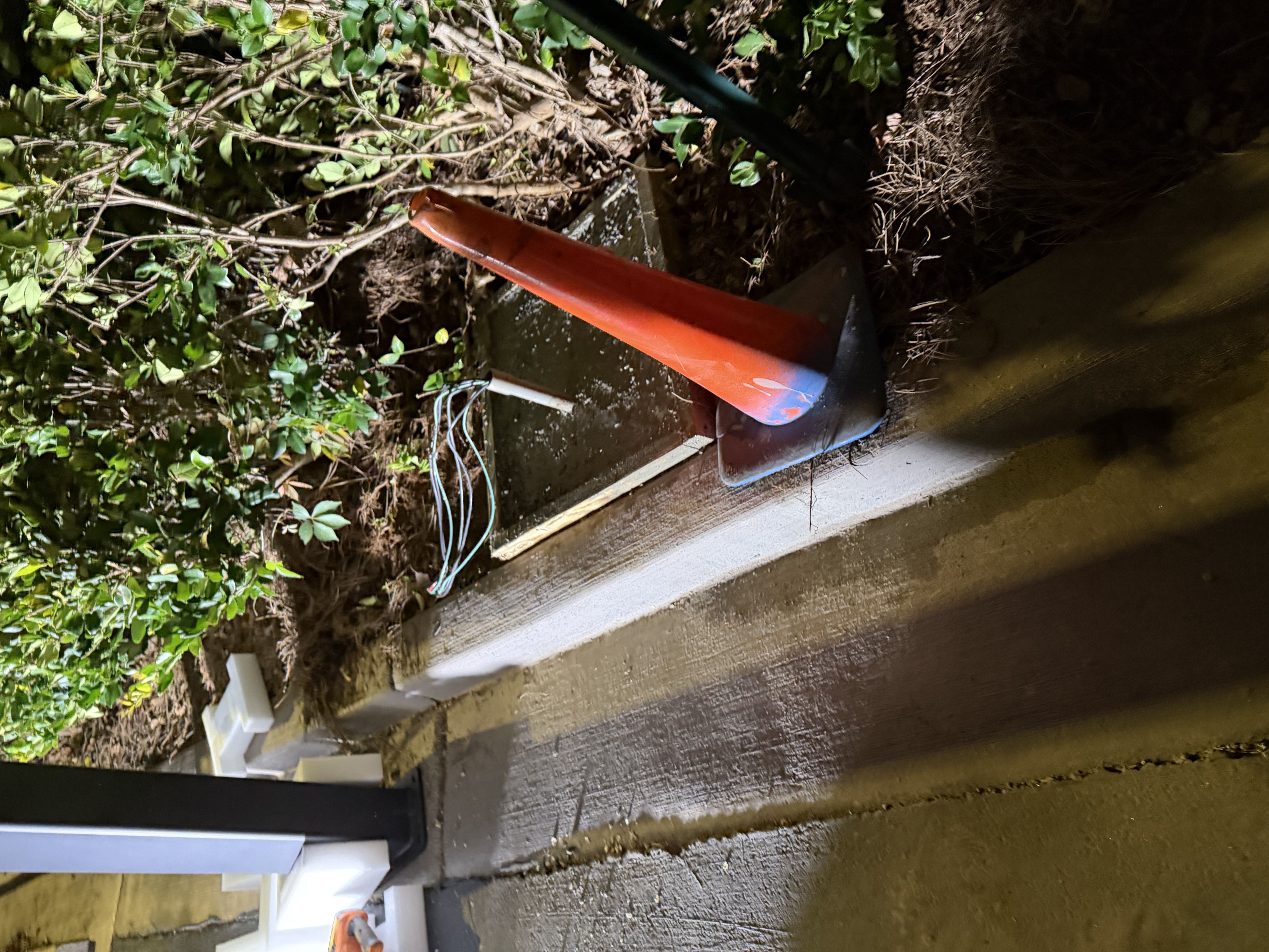 I removed the old electric vehicle charging stations, poured a new concrete pad, and ensured it was properly cured before installing the new EV infrastructure.