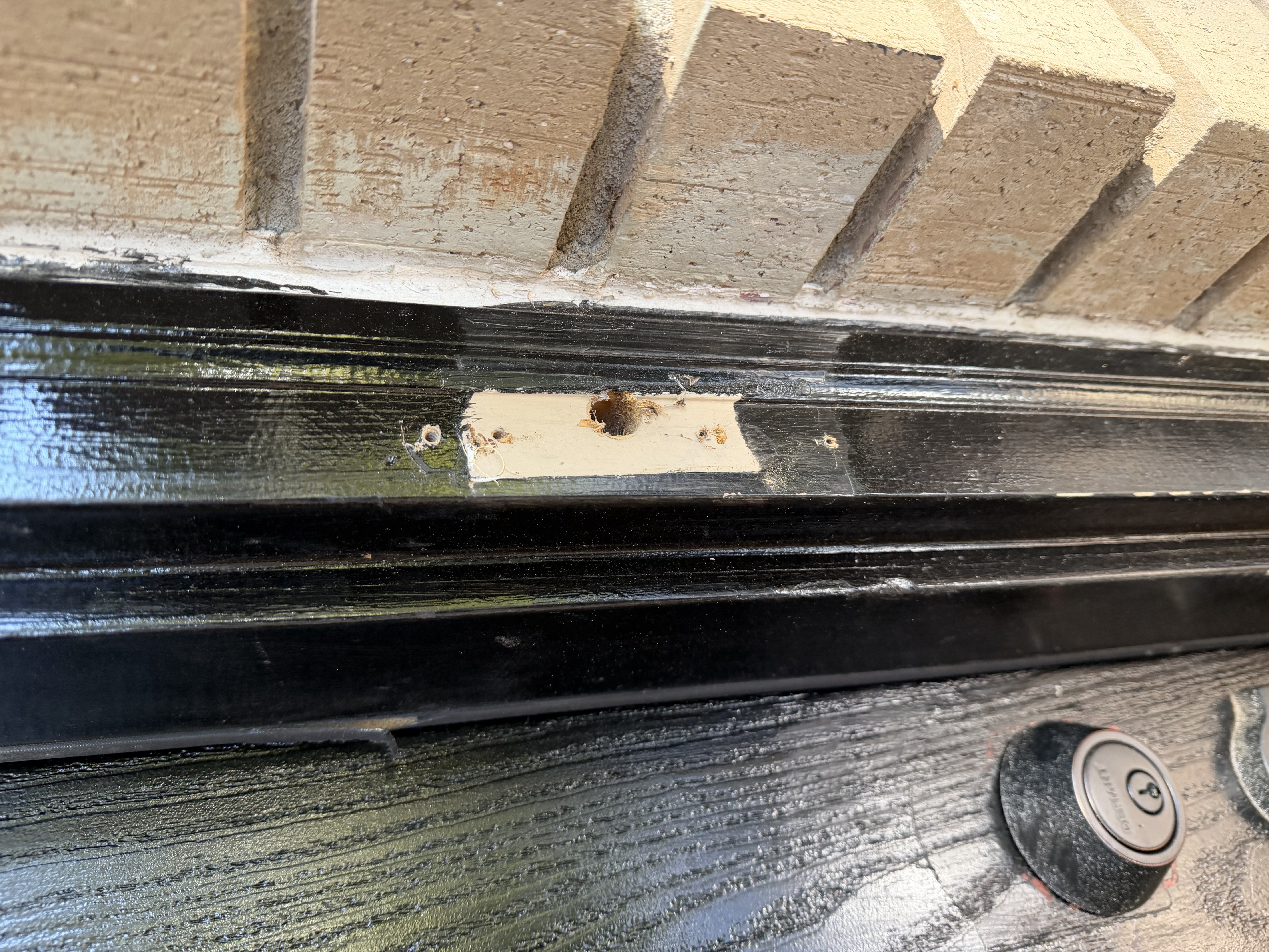 We relocated the wired doorbell, carefully disconnecting it from its original position and rewiring it to a new spot, ensuring it functions perfectly with the new storm door.