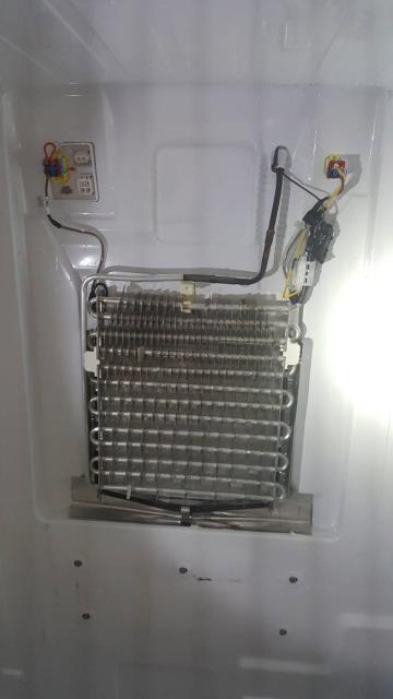 Tempe, AZ - CONCERN: Customer reports Samsung refrigerator is leaking water into refrigerator section, building ice on back wall, and not cooling well in refrigerator section only. Model RF26HEFNDSR/AA DIAGNOSTIC AND CAUSE: Found the source of the leak coming from melting ice not going down refrigerator defrost drain. Removed back panel to inspect for clogged drain line. Found large amount of ice build-up on and around refrigerator side evaporator, also found the defrost drain restricted with ice and debris,. CORRECTION: Cleared the refrigerator defrost drain of ice and debris, removed ice from evaporator and surrounding areas, operation now normal. 60/Baseline In Tempe AZ Tempe, AZ - CONCERN: Customer reports Samsung refrigerator is leaking water into refrigerator section, building ice on back wall, and not cooling well in refrigerator section only. Model RF26HEFNDSR/AA DIAGNOSTIC AND CAUSE: Found the source of the leak coming from melting ice not going down refrigerator defrost drain. Removed back panel to inspect for clogged drain line. Found large amount of ice build-up on and around refrigerator side evaporator, also found the defrost drain restricted with ice and debris,. CORRECTION: Cleared the refrigerator defrost drain of ice and debris, removed ice from evaporator and surrounding areas, operation now normal. 60/Baseline In Tempe AZ