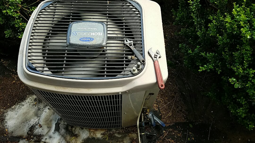 Poor cooling on this Carrier AC system due to 80% clogged condenser coil.