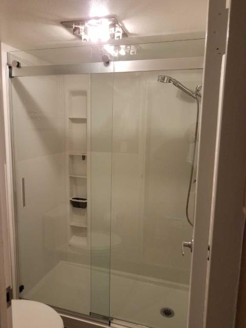 Denver, CO - Finished installing a new Kohler walk-in shower. This new shower will give them more space than their old bathtub. Denver, CO - Finished installing a new Kohler walk-in shower. This new shower will give them more space than their old bathtub.