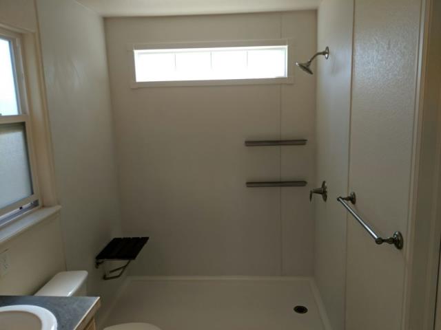 Fort Collins, CO - After photo of tub/shower combo, now a brand new Kohler Shower System in white with brush nickel floating shelves, fixtures and teak fold down seat!! Fort Collins, CO - After photo of tub/shower combo, now a brand new Kohler Shower System in white with brush nickel floating shelves, fixtures and teak fold down seat!!
