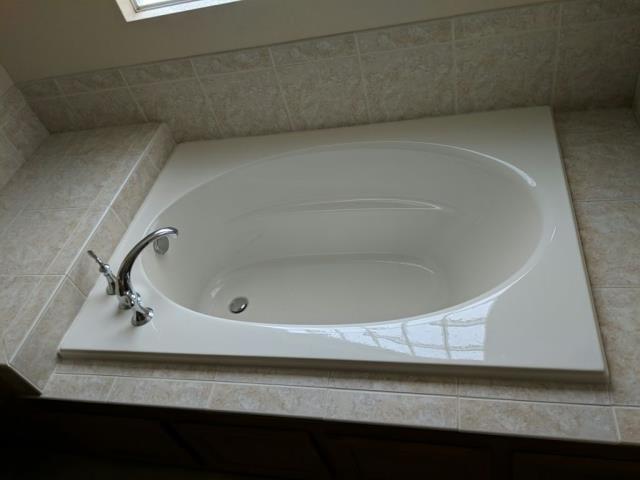 Littleton, CO - Removed an old jetted tub and installed a new Kohler bathtub. Littleton, CO - Removed an old jetted tub and installed a new Kohler bathtub.