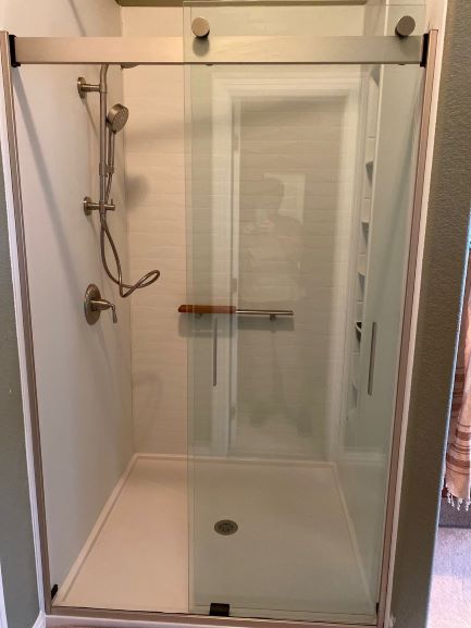 Colorado Springs, CO - Our customer in Colorado Springs designed a perfect Kohler LuxStone shower with a Hydrorail shower head, shower barre and shower locker for added space! The non-porous surface of the white brick will make cleaning a breeze! Colorado Springs, CO - Our customer in Colorado Springs designed a perfect Kohler LuxStone shower with a Hydrorail shower head, shower barre and shower locker for added space! The non-porous surface of the white brick will make cleaning a breeze!