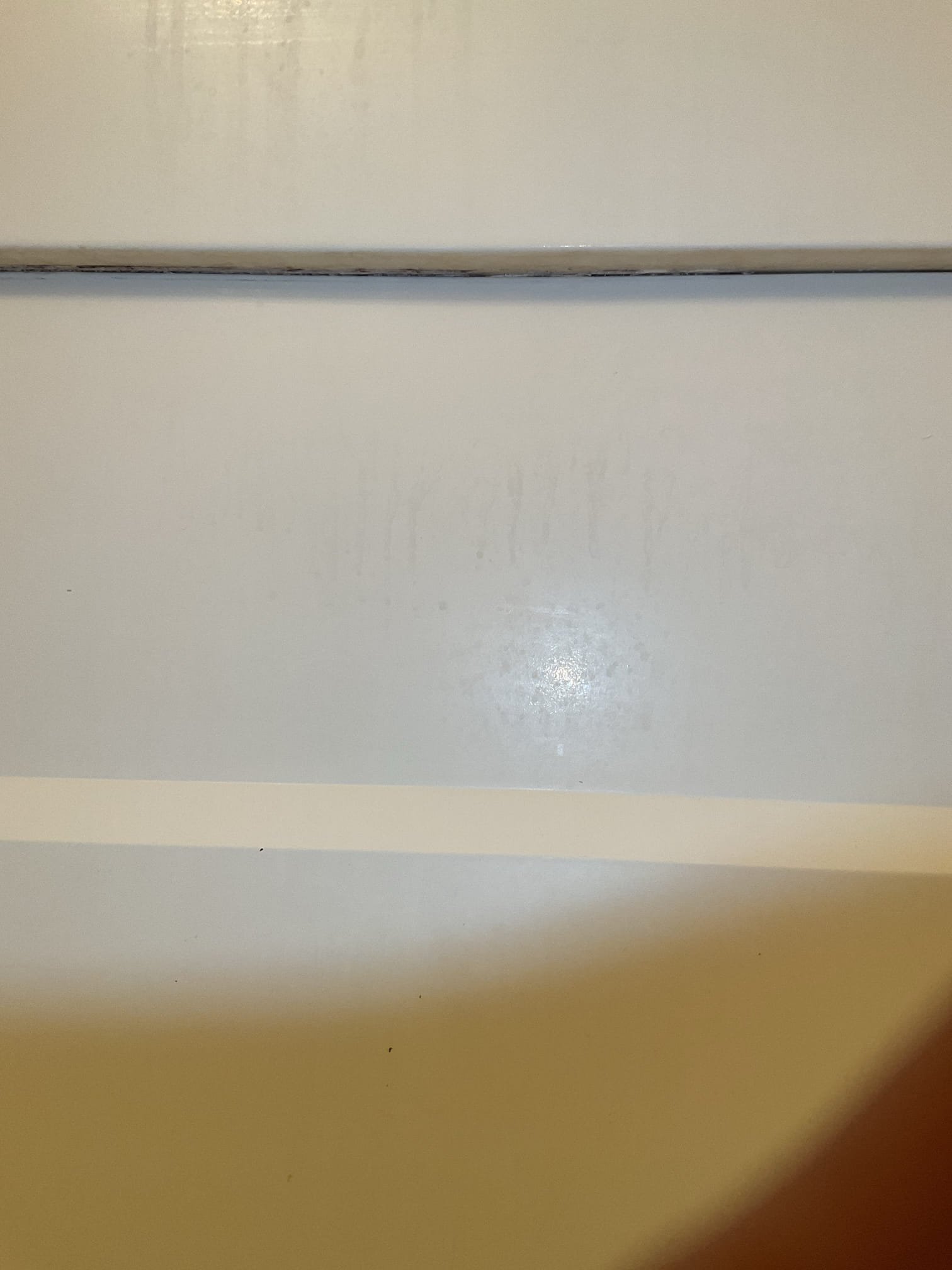 -Upon arrival the technicians removed both toilets and water supply lines. The water to the unit had to be turned off to complete the scope of work. There was one gate valve in the ceiling assembly above the water heater. This gate valve turns the water off to the clothes washer valve and kitchen. It also turns the water off to the water heater and kitchen in the unit above. After discovering that the water to the bathrooms in the unit were still under pressure the technicians turned the water off to the whole building and installed two ball valves. One for the hot water in the bathrooms and one for the cold in both bathrooms. After completing this techs were able to remove both vanities, replace 2 toilet shutoffs with compression stops, and remove existing shower. 

-Second day techs removed the existing tub drain. The drain was plumbed with 1 1/2" copper and 2" cast iron. The copper was removed from the cast iron ptrap. A rubber bushing was used to adapt from the cast iron to pvc. Mo