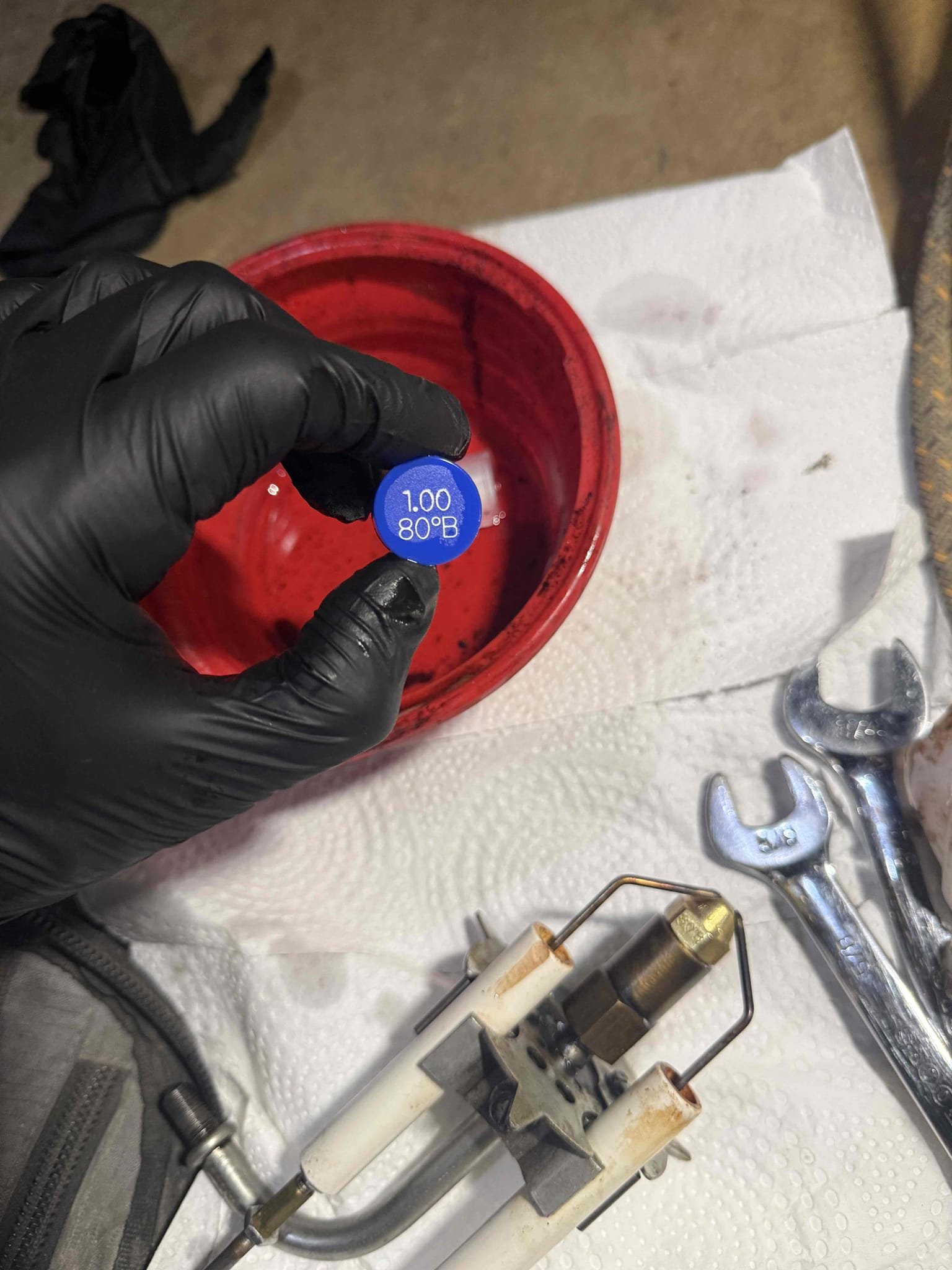 Performed annual maintenance on the oil-fired boiler, including replacement of the nozzle, oil filter, and pump strainer. The boiler was heavily sooted; all heat exchanger surfaces were thoroughly brushed and vacuumed.

During inspection, it was found that the boiler sections are leaking combustion products. This indicates that the boiler has failed and is no longer safe for operation. The unit was red-tagged and disabled for safety reasons.

Estimates for boiler replacement will be provided via email as soon as possible.
