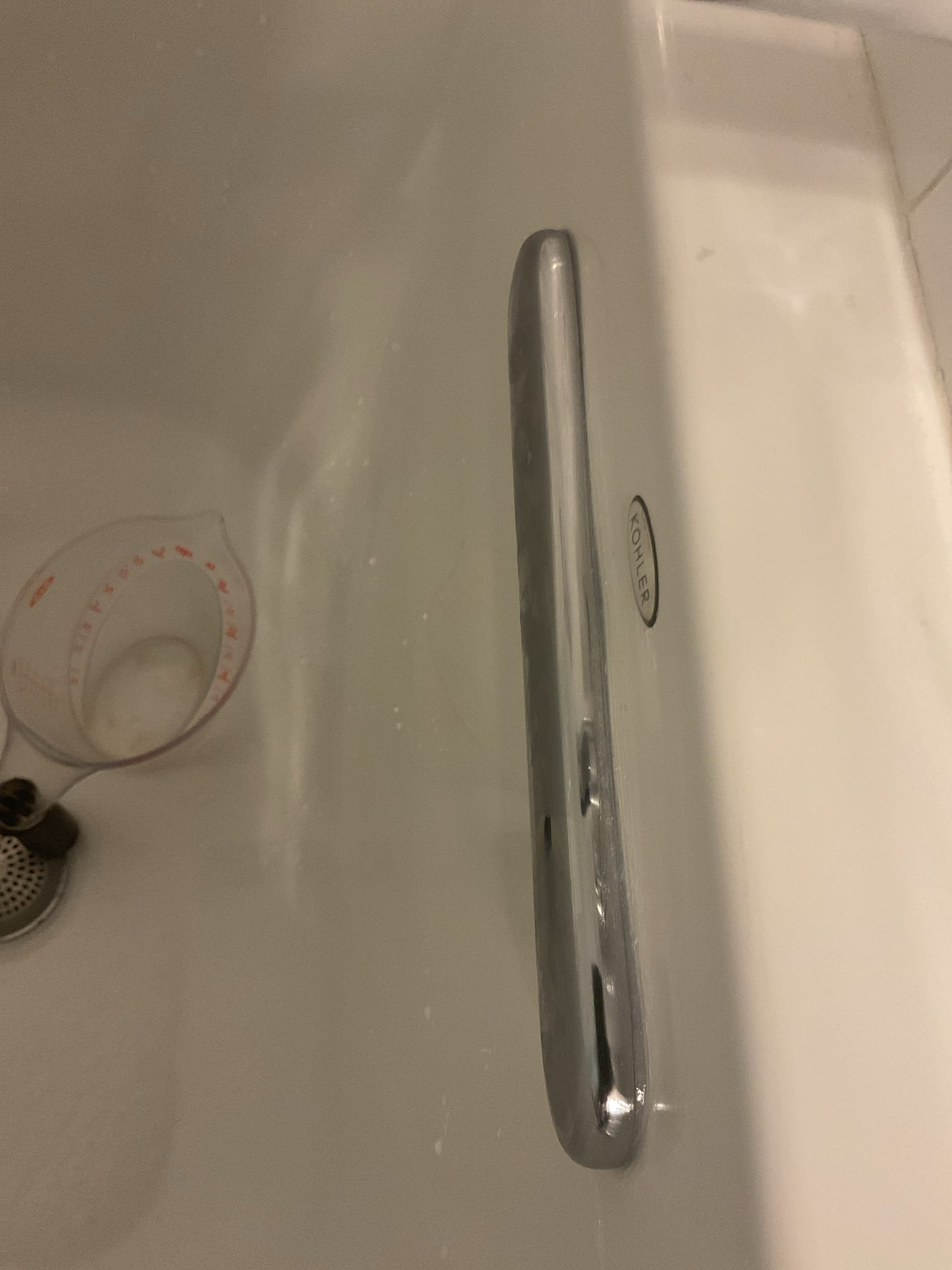 Upon arrival, the homeowner pointed out a ceiling area that had previously leaked. Visual inspection confirmed signs of a past leak. The homeowner noted that the shower had not been used for two weeks, while the toilet continued to be used without issue. During our initial evaluation, we ran the tub faucet and shower head for 10 minutes each with no signs of leakage. We also poured water using a pitcher over all finished cover plates, including the tub spout, shower trim, waste, and overflow plates, for several minutes—again observing no leaks through the ceiling below.

To continue diagnostics, we performed a drainage leak test by cutting a 16” x 16” access opening in the ceiling for proper inspection. Through this access, we determined the waste and overflow assembly to be the source of the leak. Upon removal of the cover plate, we found the three screws compressing the gasket to be extremely loose. We tightened all screws, reinstalled the cover plate, and applied silicone around the