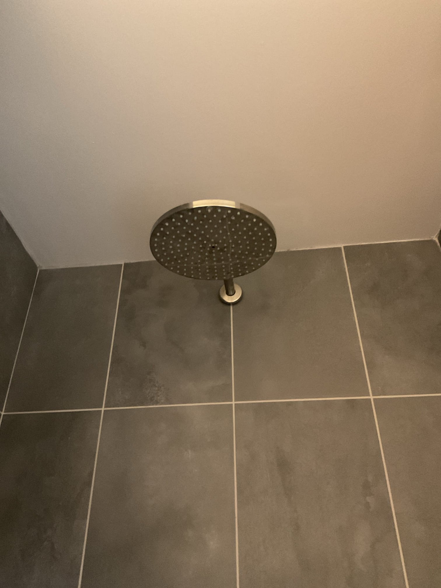 Upon inspection, the home’s low water pressure was found to be caused by a clogged carbon filter. The technician obtained a replacement filter from the supply house and returned to complete the repair. Water was shut off at the inlet, outlet, and boiler feed due to the piping design. The system pressure was relieved, the canister removed, and the carbon cartridge replaced. A lubricant was applied to the O-ring before reinstalling the canister. After turning the water back on, the system was tested for leaks and proper operation—no leaks were present, and water pressure was fully restored throughout the home.
We will return at a later date to install a new dual filter housing with a three-valve bypass to separate sediment collection from the carbon filtration, improving maintenance and long-term system efficiency.
A bead of white caulking was applied around the base of the tub spout to prevent water damage and leakage into the wall, as a gap was discovered behind the spout during inspec