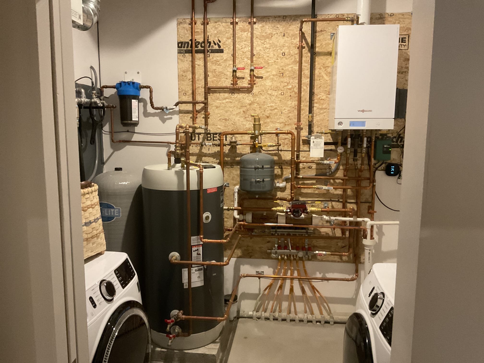 Upon inspection, the home’s low water pressure was found to be caused by a clogged carbon filter. The technician obtained a replacement filter from the supply house and returned to complete the repair. Water was shut off at the inlet, outlet, and boiler feed due to the piping design. The system pressure was relieved, the canister removed, and the carbon cartridge replaced. A lubricant was applied to the O-ring before reinstalling the canister. After turning the water back on, the system was tested for leaks and proper operation—no leaks were present, and water pressure was fully restored throughout the home.
We will return at a later date to install a new dual filter housing with a three-valve bypass to separate sediment collection from the carbon filtration, improving maintenance and long-term system efficiency.
A bead of white caulking was applied around the base of the tub spout to prevent water damage and leakage into the wall, as a gap was discovered behind the spout during inspec