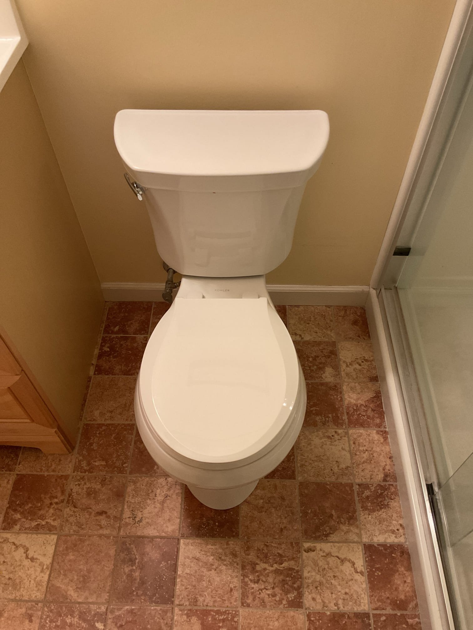 The existing toilet was replaced due to its age and instability caused by rocking. The broken flange was also replaced and raised to floor level to ensure a secure installation. After completion, the toilet was tested, confirming proper operation with no leaks present. The customer was not home at the time of completion, and the invoice will be sent via email.