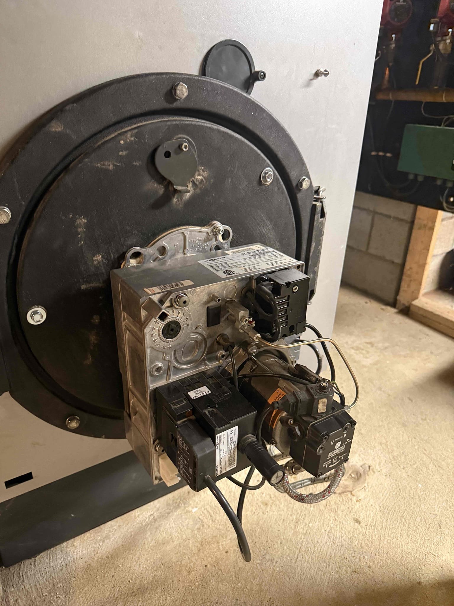 I performed the annual service on the Peerless oil boiler, which included replacing the nozzle, oil filter, and strainer, as well as brushing and vacuuming the boiler and smoke pipe. I re-cemented the smoke pipe connection into the chimney and checked both the pump pressure and pump cutoff. During the safety check, I found that the boiler had no water and the water feeder was stuck. I bumped the feeder to restore operation, and it began to feed the boiler, though it was not fully filled at the customer’s request. With the customer’s approval, I replaced the water feeder on the boiler and purged the heating zone for the big room, which was not heating properly. Afterward, I performed combustion and draft tests, and all readings were within normal operating range. The boiler is currently working as it should. We will need to return to clean the Viessmann unit.

At this time, I recommend replacing the oil tank legs, as they are heavily rusted and could pose a safety concern if left unaddr