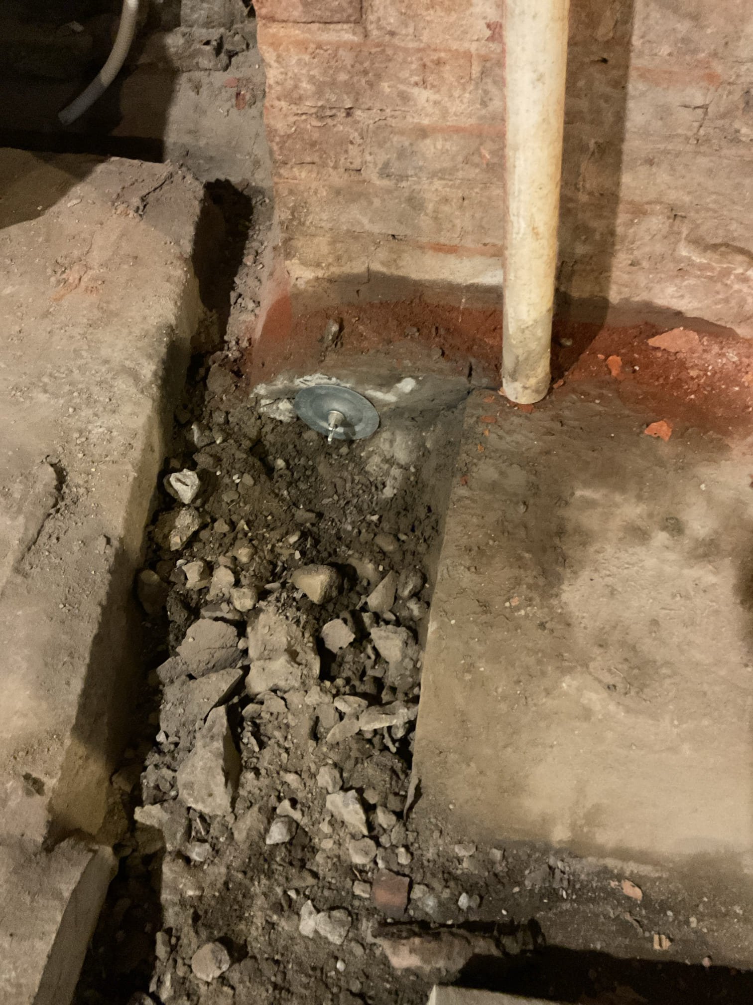 We will cut and cap an unused cast iron pipe by removing approximately 3–4 feet of concrete to access the line, then install PVC with glue caps on both ends. A smoke test will be performed to verify the connected roof vent, which will require a separate roofer to properly seal and cap at the roof level.( due to smoke test there will be a smell of smoke in the home)
11/3/25 we cut concrete and 4 inch cast pipe in the basement floor. We Left caps with customer for roofer to install. Preformed smoke test and smoke came out of multiple vents due to that result we left the 3 sweet vents to keep rain and snow out and still be able to have air for the rest of the house from the vent. Customer would like bill sent to the. Everything is working as it should.