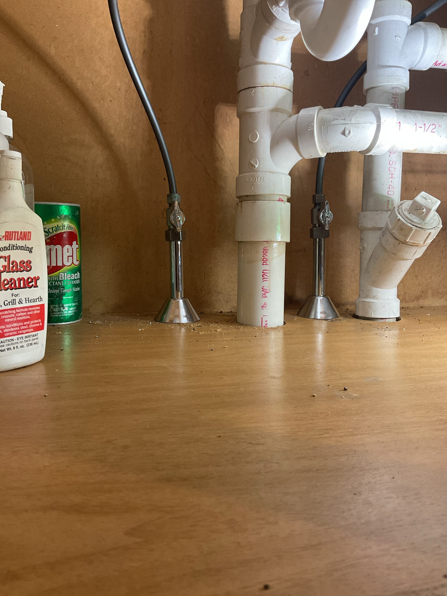 -The existing tailpieces and center waste outlet connections were found to be leaking. To correct the issue, we replaced the tailpieces, P-trap and installed a new center waste outlet to ensure a secure, leak-free connection. All new tubular fittings were installed using thread sealant on all gaskets. Both sink bays were filled completely and drained to verify proper operation. No leaks were observed at the time of testing.
-During inspection, corrosion was noted on the hot and cold shutoff valves and the adjacent pipework beneath the kitchen sink. Both valves were replaced to restore proper functionality and ensure a dependable, leak-free water supply. The water to the home was shut off and the system was fully drained. Existing valves were unsoldered and replaced with new quarter-turn shutoff valves. New escutcheons and bell covers were installed. Water supply lines were reconnected, and the system was re-pressurized to test for leaks and proper operation. No leaks were present at th