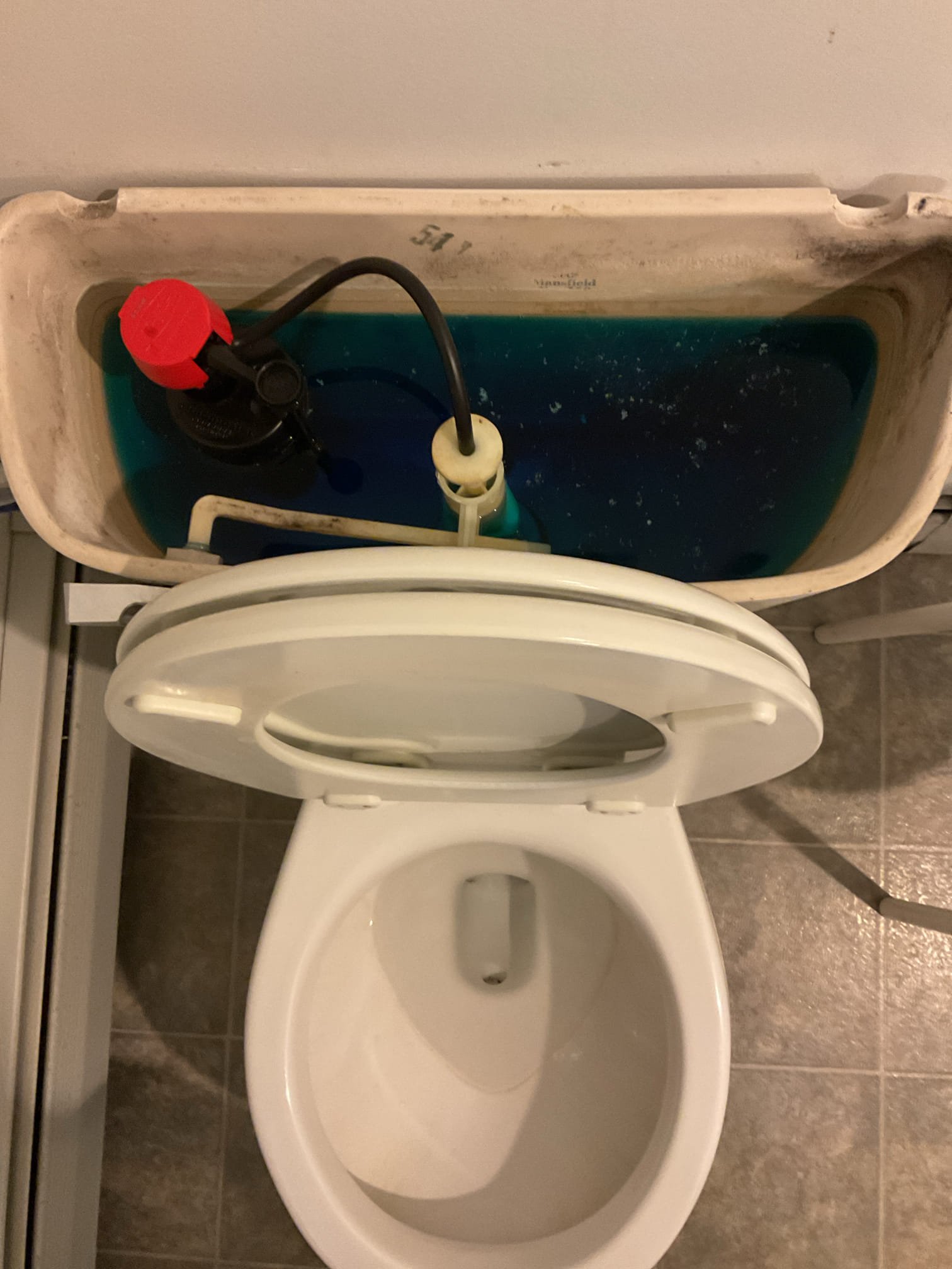 The toilet had a leak from the fill valve, indicating worn or failing components. We recommended replacing the toilet seal, fill valve, and supply line to stop the leak and ensure reliable, leak-free operation. Shut water off to toilet, vacuumed water from tank and removed existing fill valve supply line and toilet flapper. Cleaned all surfaces and installed new toilet fill valve, braided stainless supply line and toilet flapper, adjusted fill level of valve to match water fill line for tank. Flushed toilet numerous times to verify proper operation and to check for leaks with no leaks present and toilet operating properly. Applied blue dye tablet in tank to verify proper operation of flush seal with no water leaking into bowl after 20 minutes.