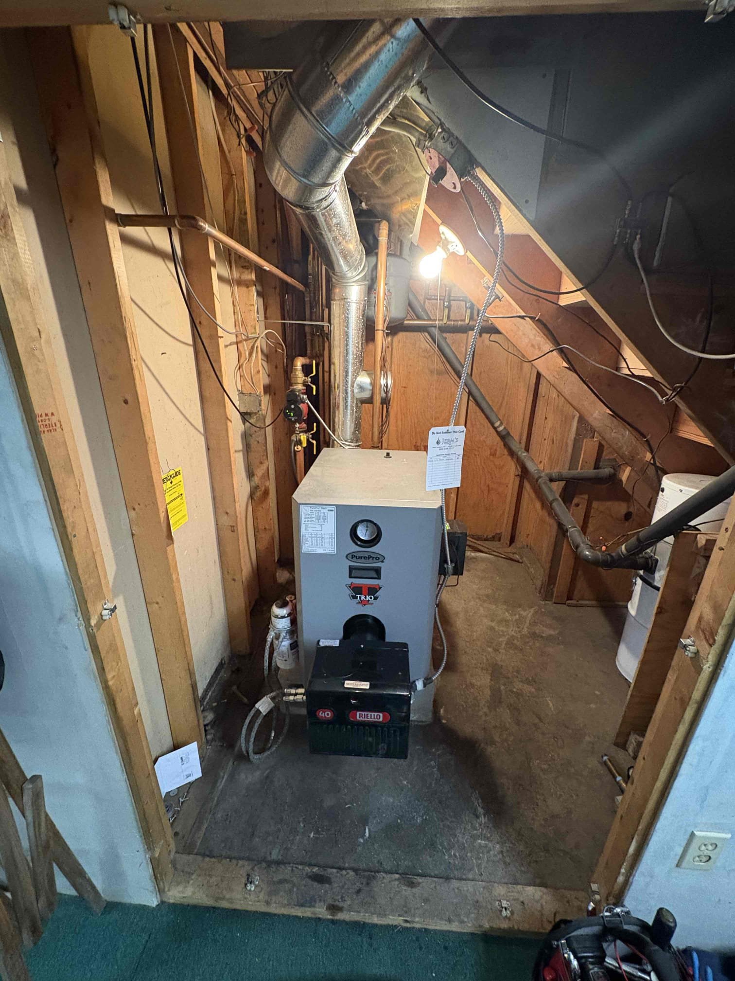 Performed annual maintenance on the Trio oil boiler. Replaced the oil nozzle, fuel filter, and pump strainer. Brushed and vacuumed the heat exchanger and flue pipe. Tested and confirmed the operation of all system safety controls. Verified proper function of all burner components.

Conducted combustion, smoke, and draft tests. During testing, found that the pressure relief valve did not reseal properly. With customer approval, replaced the boiler’s pressure relief valve. Purged air from the system and confirmed that all heating zones are circulating water properly.

Noted that the previously installed nozzle size did not match the manufacturer’s specifications, resulting in off-spec combustion readings. Installed the factory-recommended nozzle and rechecked combustion. Confirmed proper combustion performance and safe operating levels.

System is operating properly at this time.
