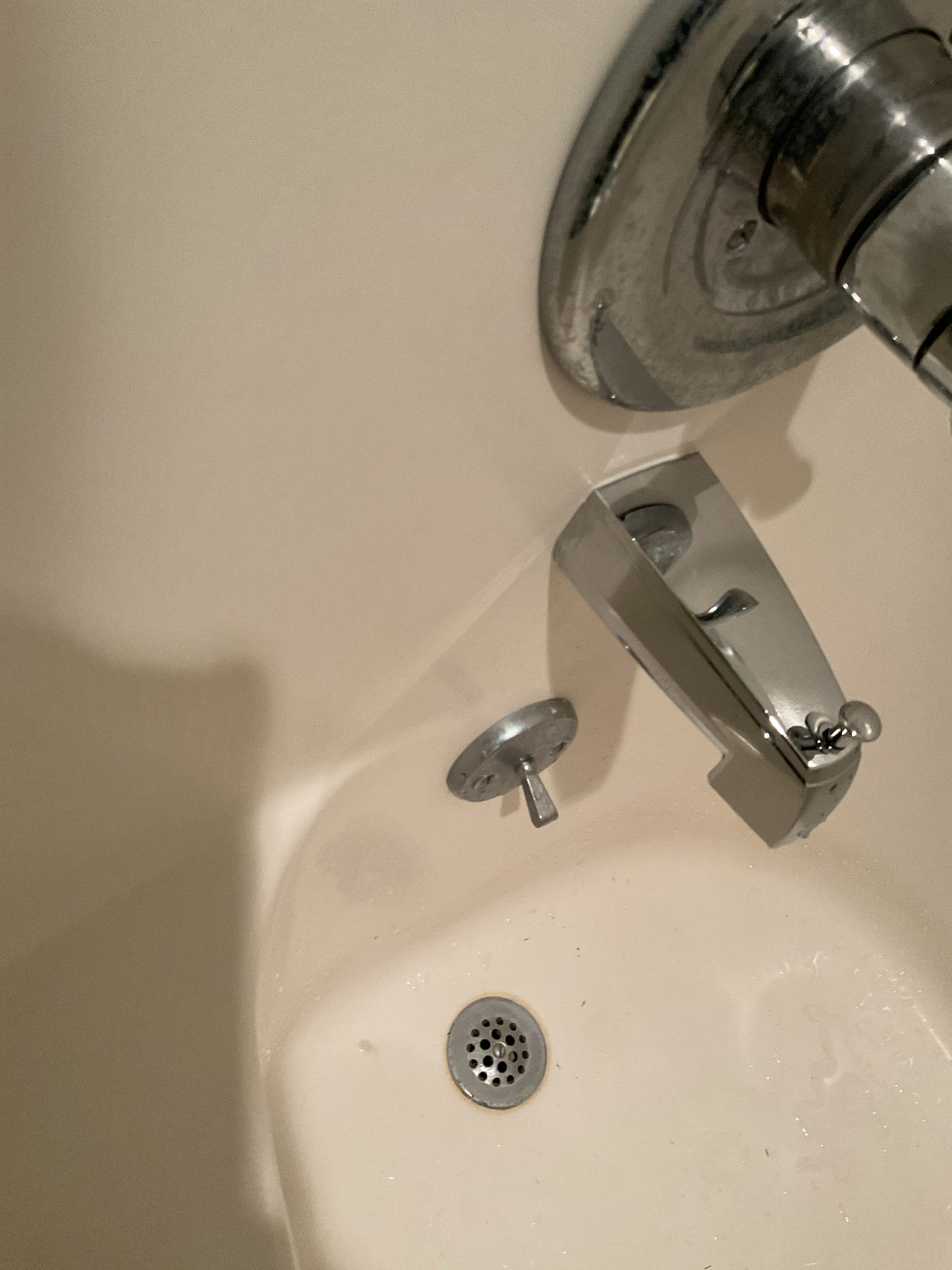 Shower Valve:
-The shower valve is not functioning properly, possible due to a worn cartridge, resulting in low cold-water pressure. We replaced the existing cartridge with a new Delta 1991 model in an attempt to restore proper water flow and ensure reliable shower performance.
-The water supply was shut off and the system fully drained. The valve handle and cartridge were removed, and the water was turned on slightly to test flow from the valve body. We observed minimal flow from the cold side and normal flow from the hot side, indicating a probable internal valve failure.
The valve body was cleaned, and new springs, seats, and a Delta cartridge were installed using appropriate lubricant. After restoring water service and testing operation, there was no improvement in fixture performance, confirming a valve failure requiring full replacement.
Tub Spout:
-The existing tub spout was difficult to operate and not functioning as intended. We replaced it with a new chrome top-lever style sp