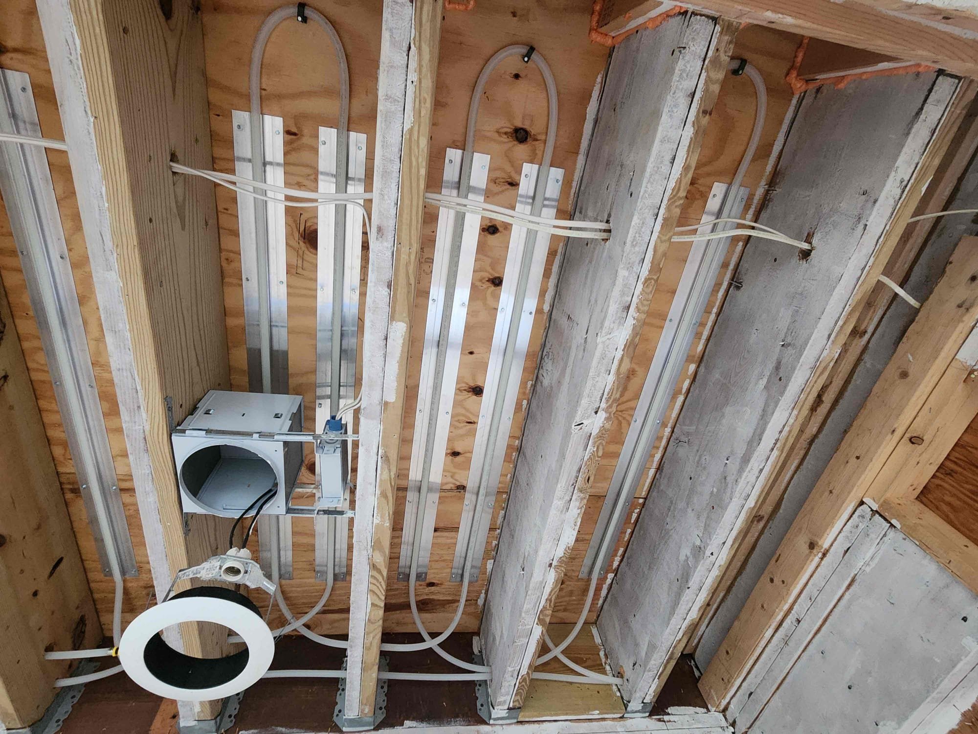 The front room was not connected to the home’s radiant heating system, resulting in uneven warmth. We will extended the radiant manifold and piping into the front room to improve comfort and ensure consistent heating throughout the space. Added 1 250 feet loop and one 100 foot loop. Set radiant temp to 110. Purged new piping out and confirmed proper operation.