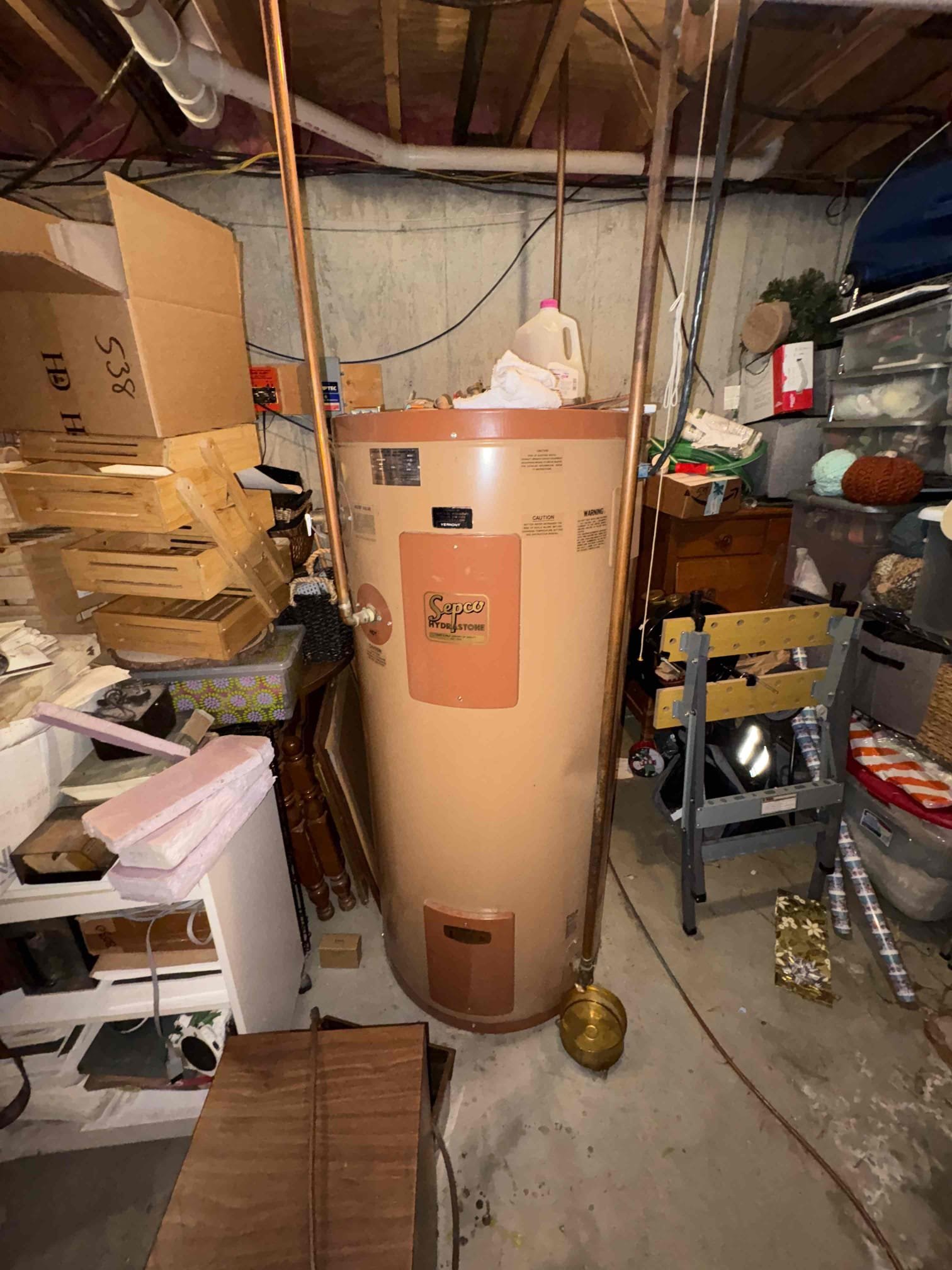 I replaced the expansion tank and relief valve on the wood and oil boiler. To address the previous pressure issues, I installed a larger Ex-60 expansion tank and confirmed there are no leaks in the system. The failed relief valve was replaced, and I repiped the connection to the boiler with a new code-compliant downspout. After purging air from the system, I verified that both the upstairs and downstairs heating zones operate properly with stable pressure and no leaks from the relief valve. The boiler’s high limit is set to 180 degrees and the low limit to 160 degrees.

During inspection, I found significant corrosion on the fuel line running from the tank to the burner. The line is uncoated copper, and I strongly recommend replacing it with a coated copper line to prevent further corrosion. I also noted that there is no backflow preventer on the domestic water feed to the boiler. Given the well issues the property has experienced, I recommend installing a backflow preventer to prevent